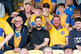 Mansfield Town fans enjoy the build-up to the win over Northampton.