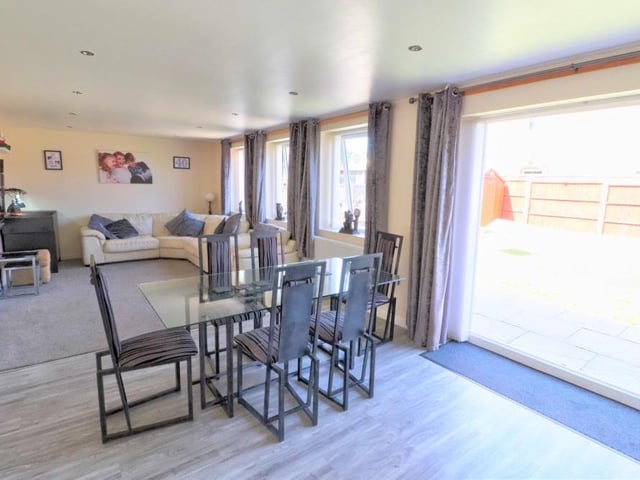 Moving on now to the lovely lounge and dining area, which extends from the kitchen. UPVC double-glazed French doors lead out to the delightful garden at the back of the proiperty.