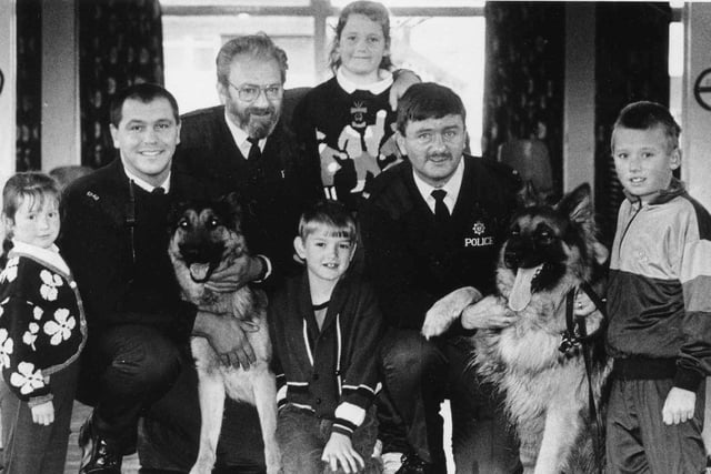 Police dog handlers Ian McDonald and Bob Dignen was pictured with school liaison officer PC Owen Clarke and Rift House Primary School pupils in this November 1991 photo.