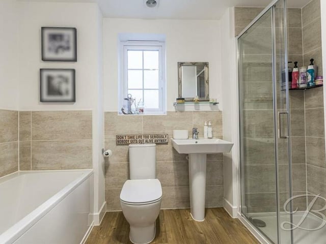 Completing the first floor is this modern family bathroom, which comprises a smart four-piece suite, featuring the option of bath or shower.