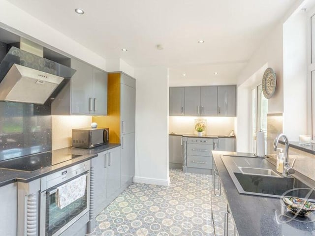 Next stop is the impressive kitchen, which comes complete with a range of integrated appliances.