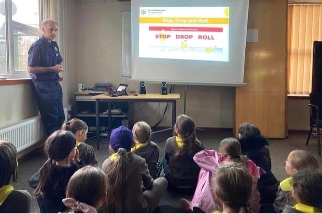The Brownies learn all about what to do in case of fire.