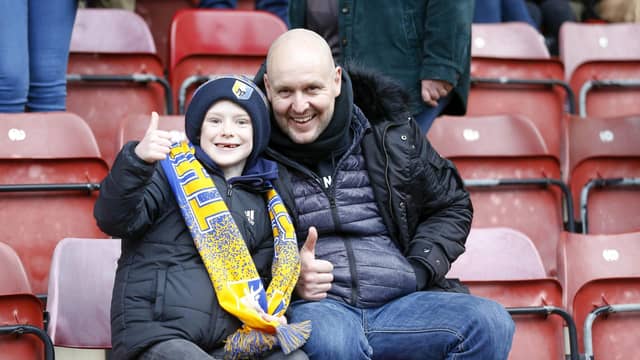 Travelling Stags fans watch the Sky Bet League 2 match against Bradford City.