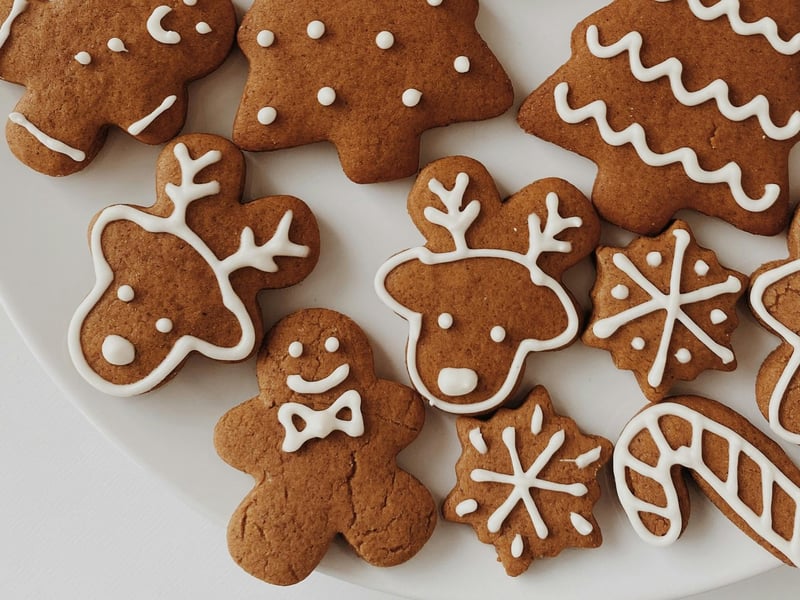 Reindeer Biscuits: This is a 'cheat's guide' and is so simple and easy! Gingerbread Men can be purchased from any shop or bakery. Simply turn the Gingerbread Man upside down, and use the head and arms as the reindeer's head, and the legs of the Gingerbread Man as antlers. Using a piping bag, fill with white icing, and pipe around the head and body to create a reindeer's head. Then, pipe antlers along the middle of the legs making sure they are attached to the 'head'. Fill in with two eyes and a mouth. Different coloured icing and little extras such as chocolate drops can also be used.