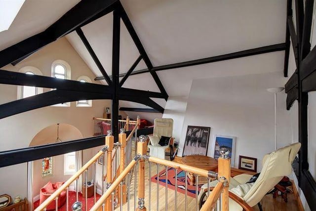 Stairs from the living room lead to this snug mezzanine area.