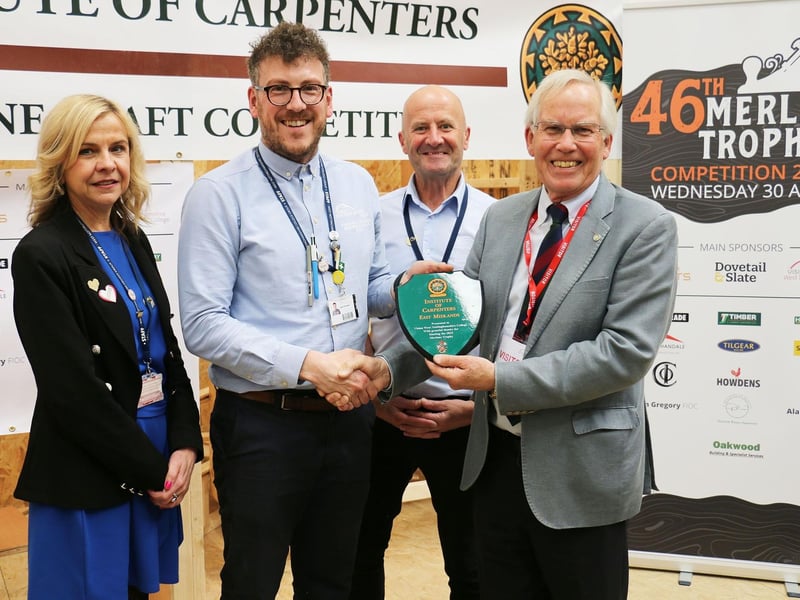 The Institute of Carpenters’ president Geoff Rhodes presents the trophy to vice-principal Diane Booth, Adam Thompson and Andy Whyley