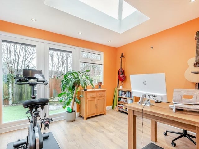 And here is that garden room extension at the back of the Mansfield house. A radiant space, it has a laminate floor, underfloor heating, six ceiling spotlights and French doors leading out to the rear garden.