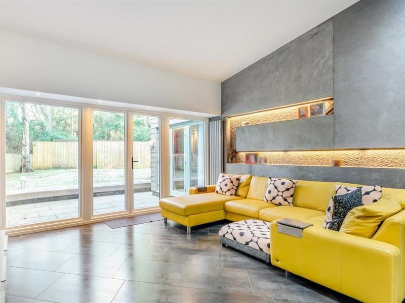The open-plan living area also includes a Porcelanosa floor-to-ceiling wall feature with Philips Hue LED lighting, controlled via an app.