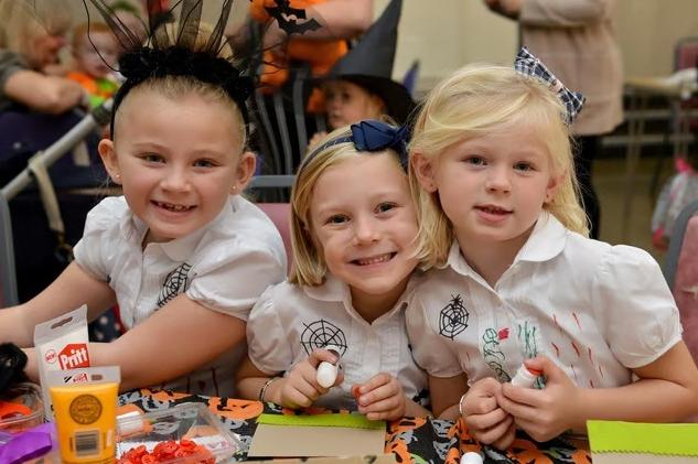 Jayda Bishton, Bebe Bishton, and Chloe Bishton having fun at the spooky Make and Bake session at Selston Parish Hall