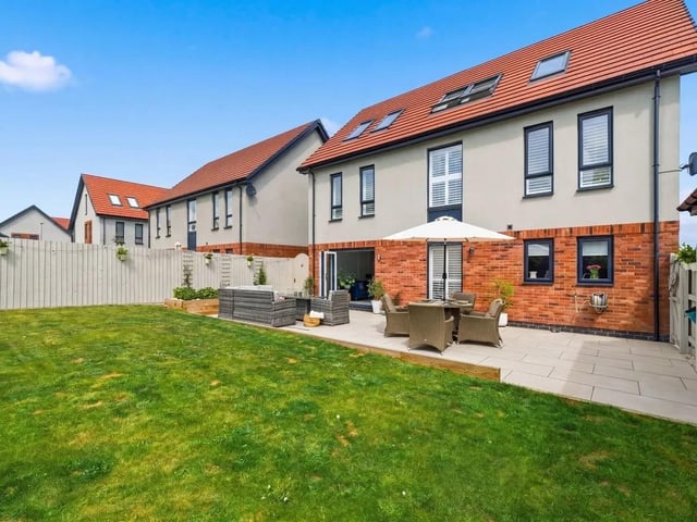Outside, the property continues to impress with a beautifully landscaped rear garden designed for both relaxation and entertaining