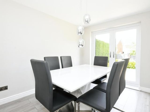At the top end of the lounge at the Carisbrooke Close house, French doors take you into this dining room. The patio doors guide you into the back garden.