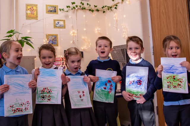 Pictured are pupils at Greenwood Primary and Nursery School with their drawings. Their school has recently received a prestigious Artsmark Award