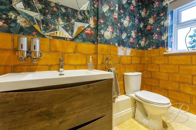 Even the downstairs loo smacks of style. It features a low-flush WC, wash hand basin and a window to the side of the house.