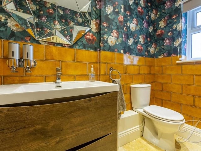 Even the downstairs loo smacks of style. It features a low-flush WC, wash hand basin and a window to the side of the house.