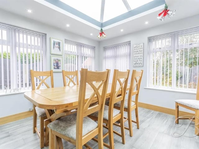 Bright and airy reception room offering a versatile space for sit down meals and entertaining. Surrounding windows along with a skylight.