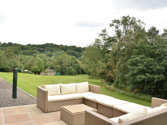 Outside is an attractive stone terrace overlooking the gardens, along with a newly built detached garage with a guest W.C. and a room above, plus a further single garage.