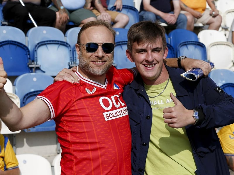 Mansfield Town fans watch the 1-1 draw at Colchester United on 16 Sept 2023.