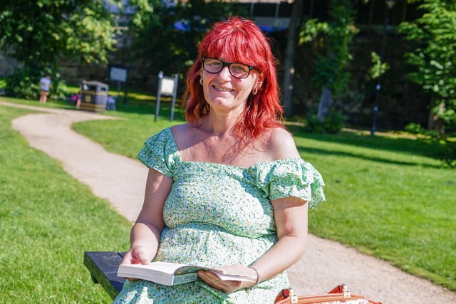 Mansfield Titchfield Park. Teresa Dent, reading a book in the sunshine.