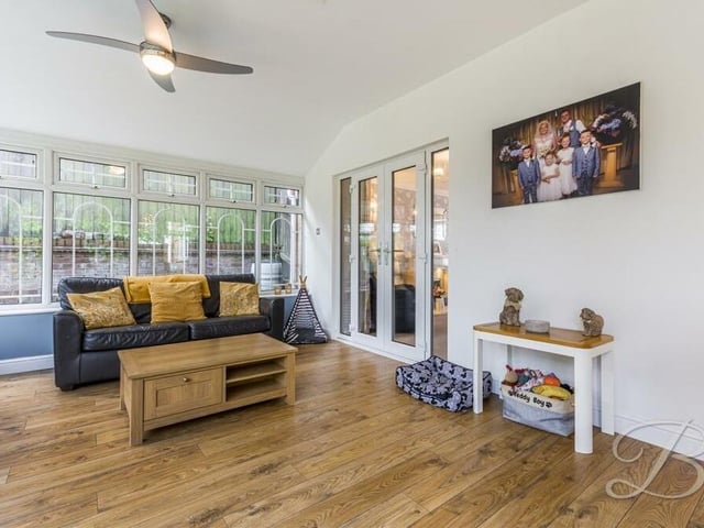 A second shot of the conservatory, where French doors lead conveniently into the property's living room.