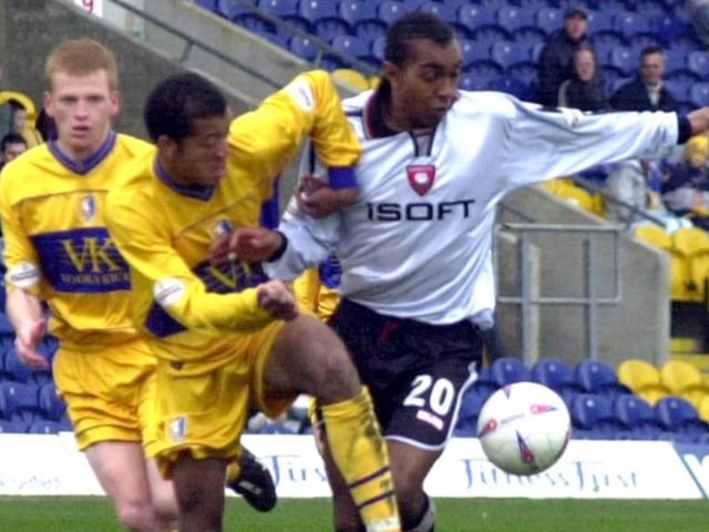 Alex Baptiste tussles with Kevin Betsy.