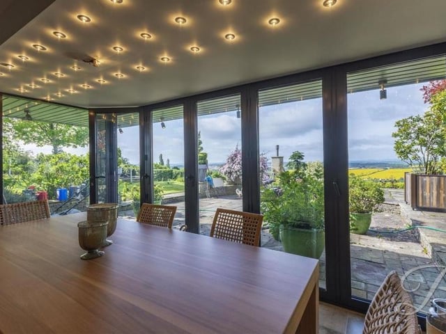 Under the downlights, dinner is served, and the menu includes stunning views of the picturesque countryside.