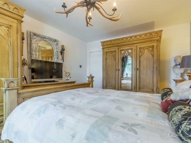 The master bedroom is steeped in classic decor, and has plenty of wardrobe space.