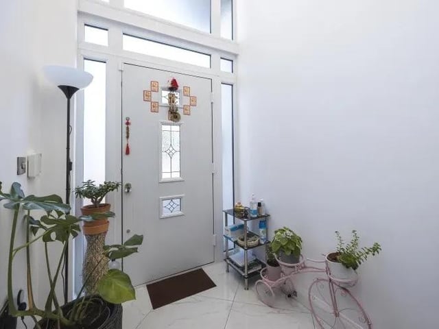 This attractive entrance hall guarantees a warm welcome as you enter the Eastwood property.