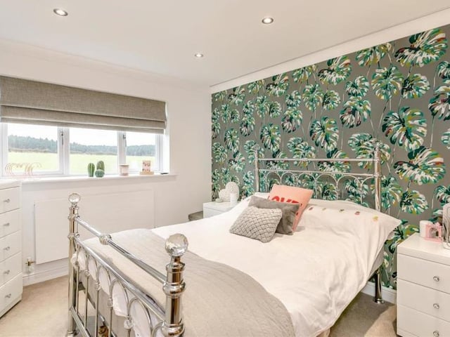 Here is the second double bedroom on the first floor of the High Oakham house. It faces the back of the property, offering enticing views of adjacent countryside.