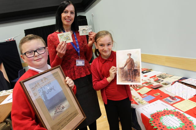 Children from Morven Park Primary took part in a WWI day at Kirkby College in 2014. Pictured are Ethan March, nine, and Paige Morley, nine, with Michelle Roberts.