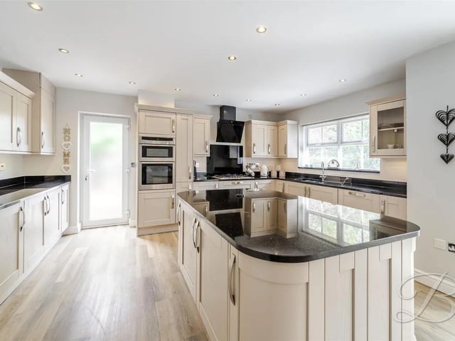 The stunning open-plan kitchen, dining, and living area has been designed for modern family living.