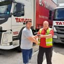 Kyle Thorburn receives his wallet from Bill Shaw - B Taylor & Sons Transport