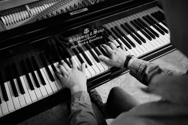 Chris Miggells playing piano
