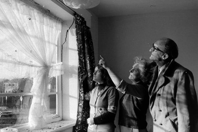 Assessing damage from the storm in 1976.