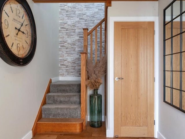 Time to pop up to the first floor now, so let's return to the entrance hall and climb the wraparound, solid oak staircase.
