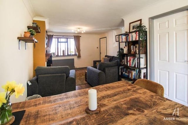 There is an abundance of space in the living room/diner, including for a dining table. The floor is laminated and there is a soft wood double-glazed window to the front of the property.
