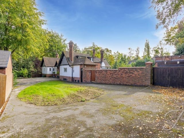 At the top of the driveway, you reach the property and its double garage. Lots of space for off-street parking.