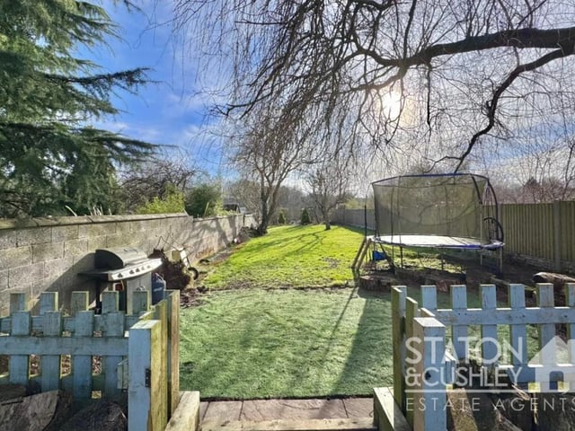 Once outside you will fall in love with space and privacy on offer across both tiers of this garden, there is ample seating space, perfect for outside dining on those summer evenings with further laid to lawn that can be utilised to your own accordance. The rear garden also boasts fish pond, outdoor speakers and access into the generously proportioned bar.