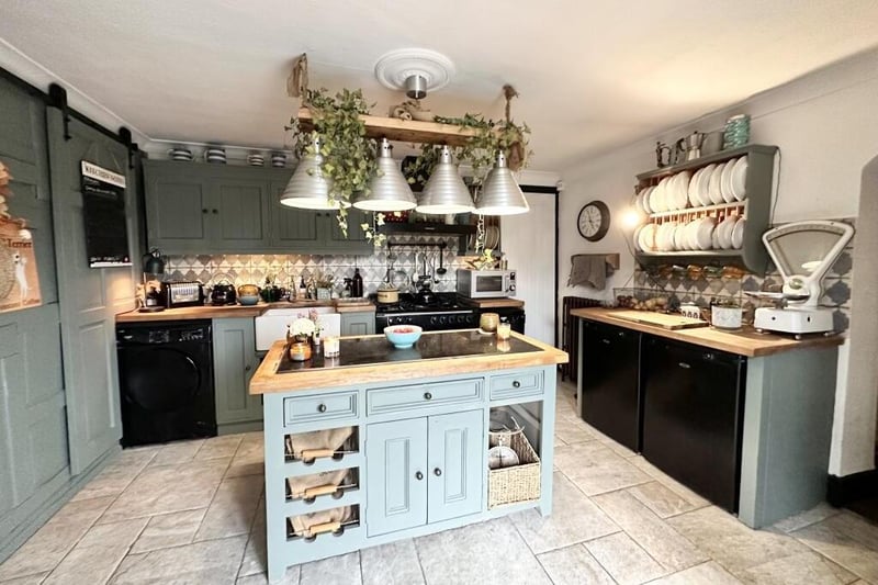 Let's begin our tour of Rose Cottage in this bespoke, hand-made fitted kitchen, which is full of rustic character.