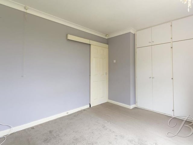 More large fitted wardrobes in this bedroom which, like the first, is well presented.