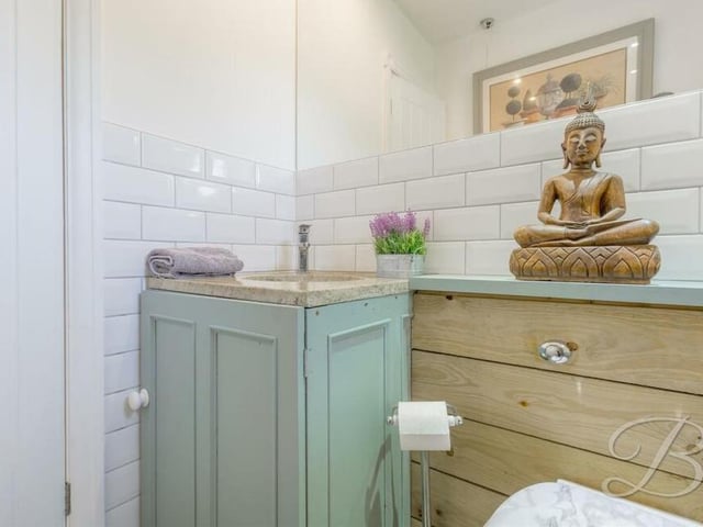 Even the downstairs toilet is full of character. It is fitted with a low-flush WC and a wash hand basin.