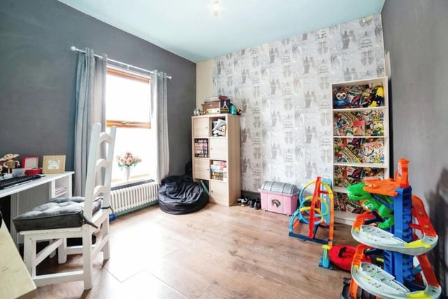 The versatile second bedroom, which also faces the front of the house, could be utilised as a children's play room or as a home office.