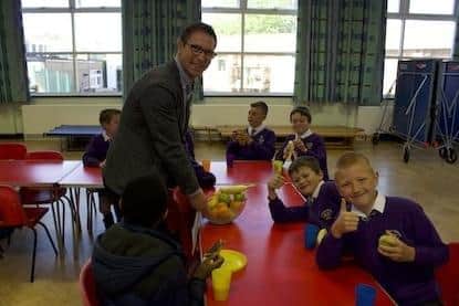 Oliver Jenkins with children at Florence Nightingale Academy.