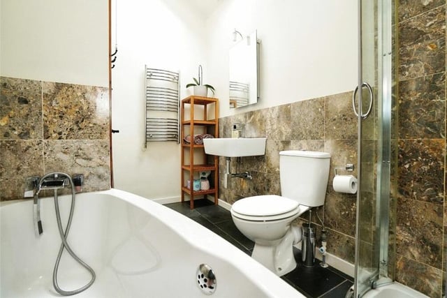 The three bedrooms on the first floor are served by this stylish family bathroom, which consists of a panelled bath, separate shower cubicle, wash basin, WC and skylight window.