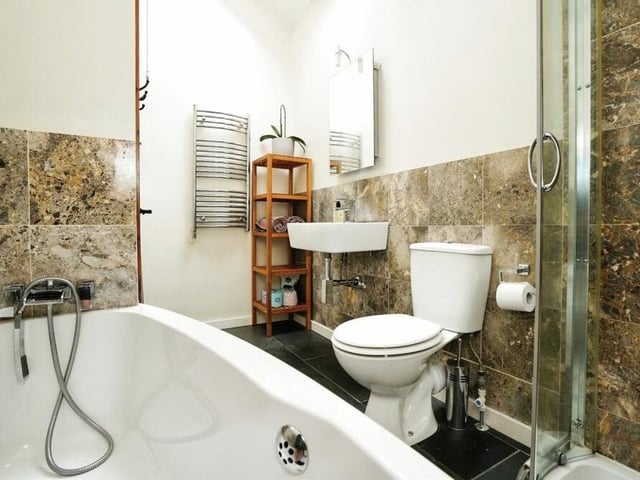 The three bedrooms on the first floor are served by this stylish family bathroom, which consists of a panelled bath, separate shower cubicle, wash basin, WC and skylight window.