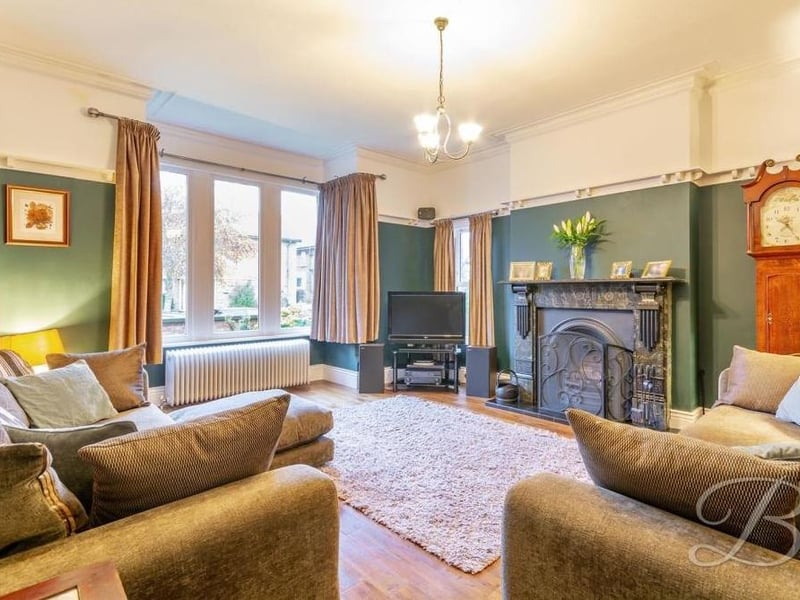 Let's start our tour of the house in the fabulous living room, which is both spacious and comfortable. It has a wooden floor, a window to the side of the property and a bay window at the front.