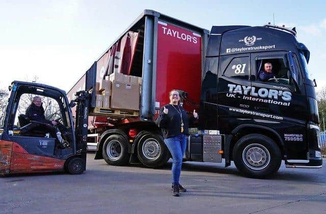 Bugosia Kavangh pictured with truck driver Mark Taylor of Taylors Transport  in his cab and his dad Alan Taylor, the company's MD