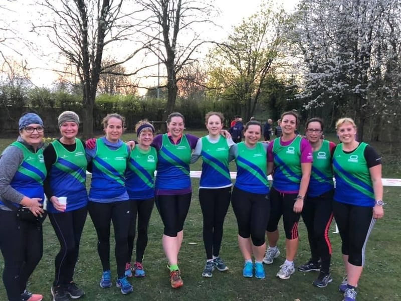 One of the former Mansfield Harriers ladies' team gather for a team picture before a race.