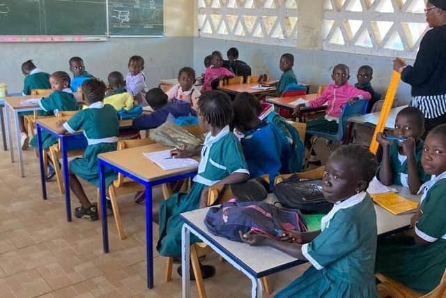 African children making use of desks and chairs provided by NPAC.