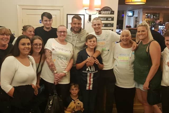 Sharon with her family and friends