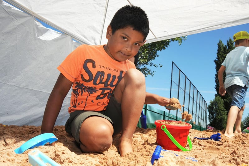 Crescent Primary School's beach day. Farhan starts work on a sand castle.